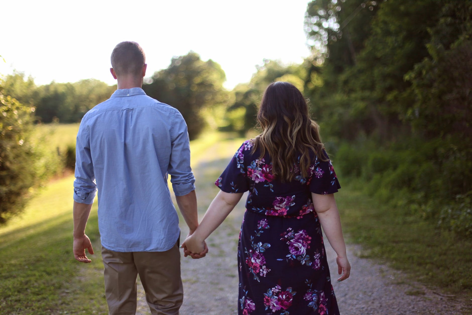 adults couple couple walking grass