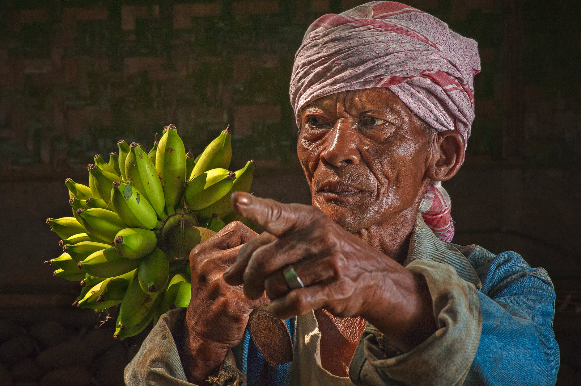 woman holding bananas figurine