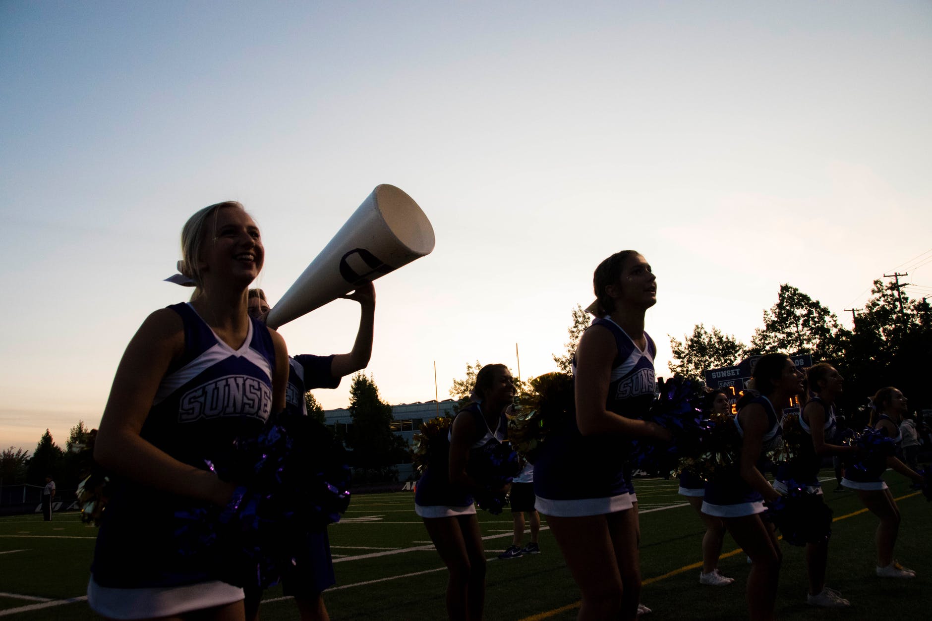 cheering squad on football field